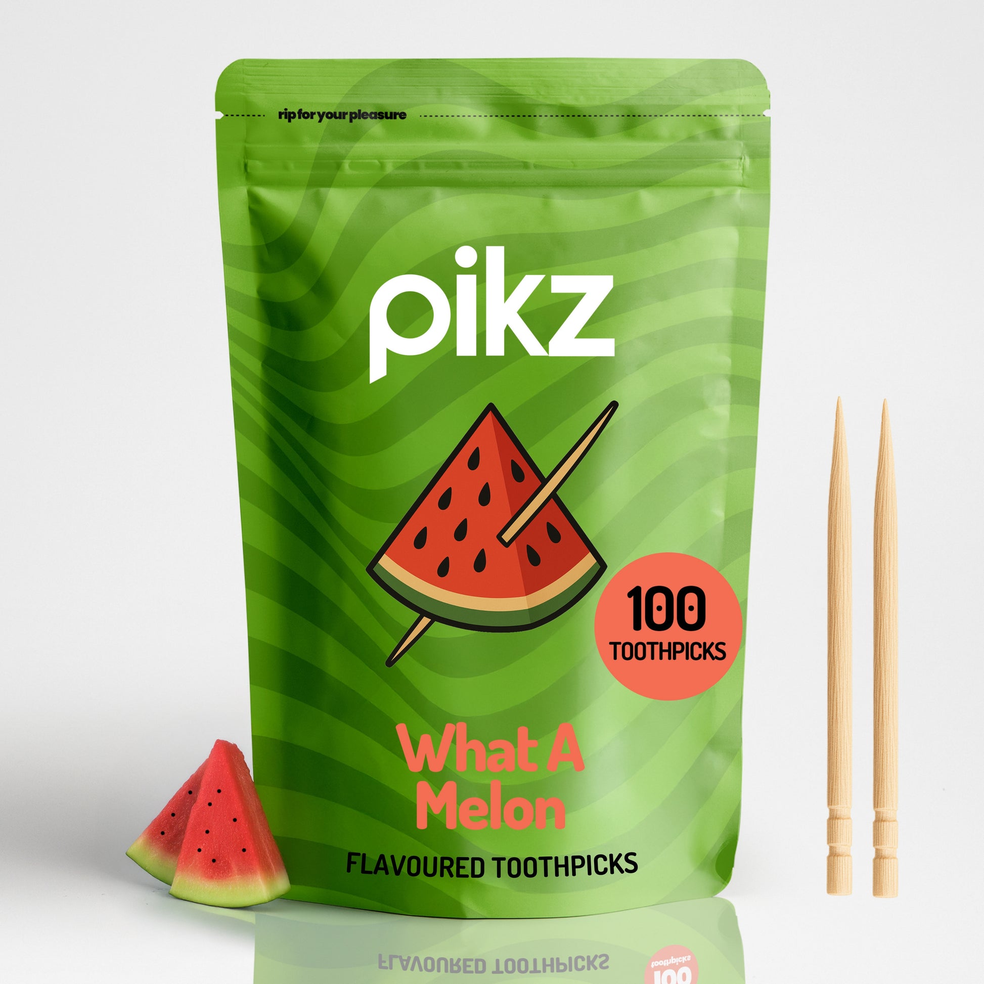 Green packaging of pikz watermelon-flavored toothpicks with a watermelon slice illustration on a white background.